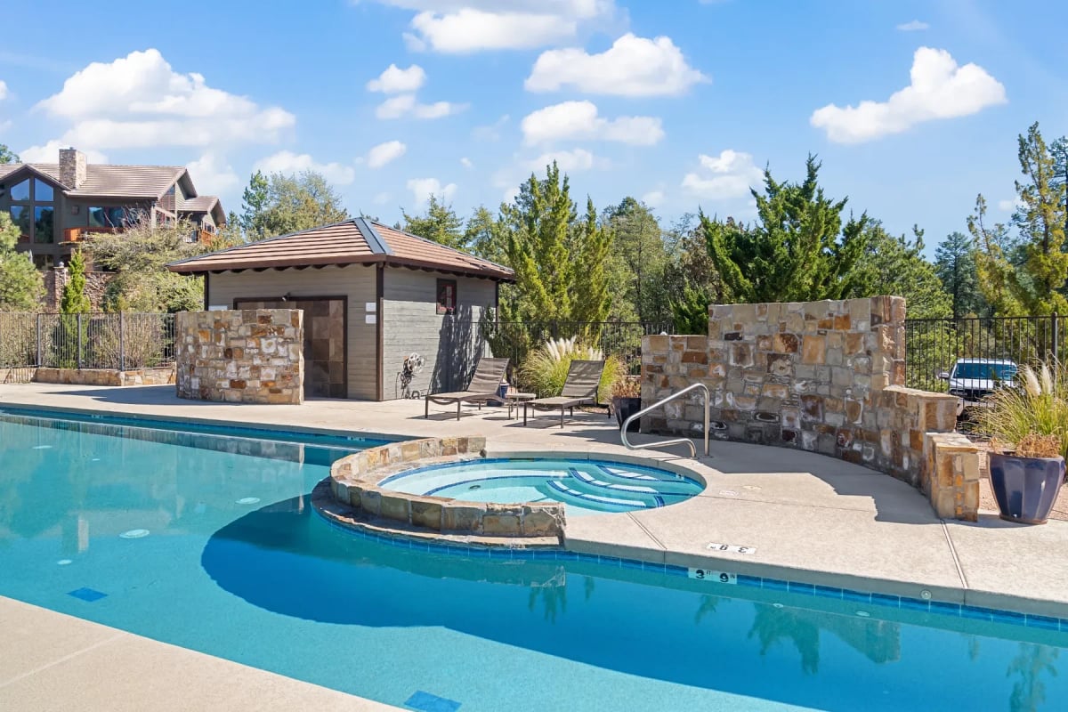 a pool and spa at the rim club house