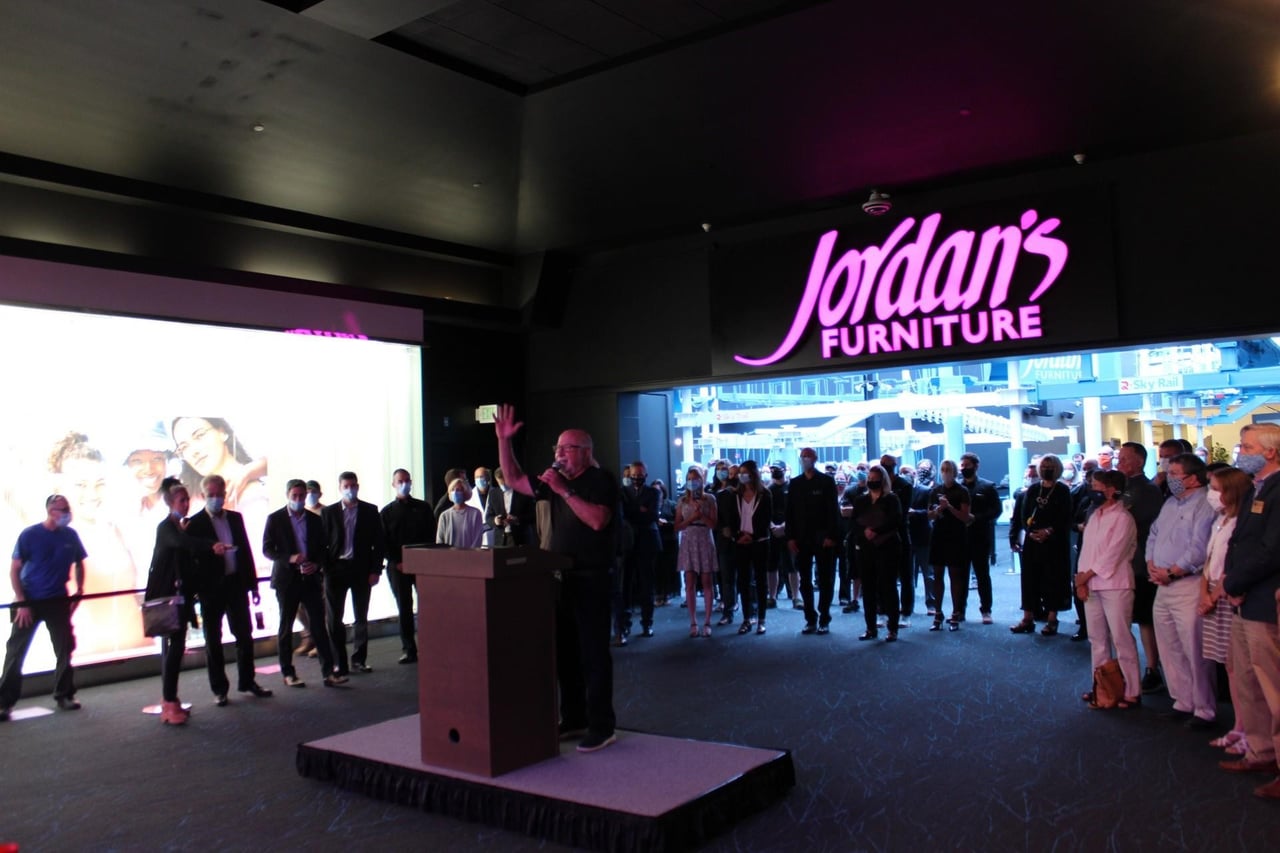 Jordan's Furniture CEO Eliot Tatelman addresses the crowd at the ribbon-cutting ceremony