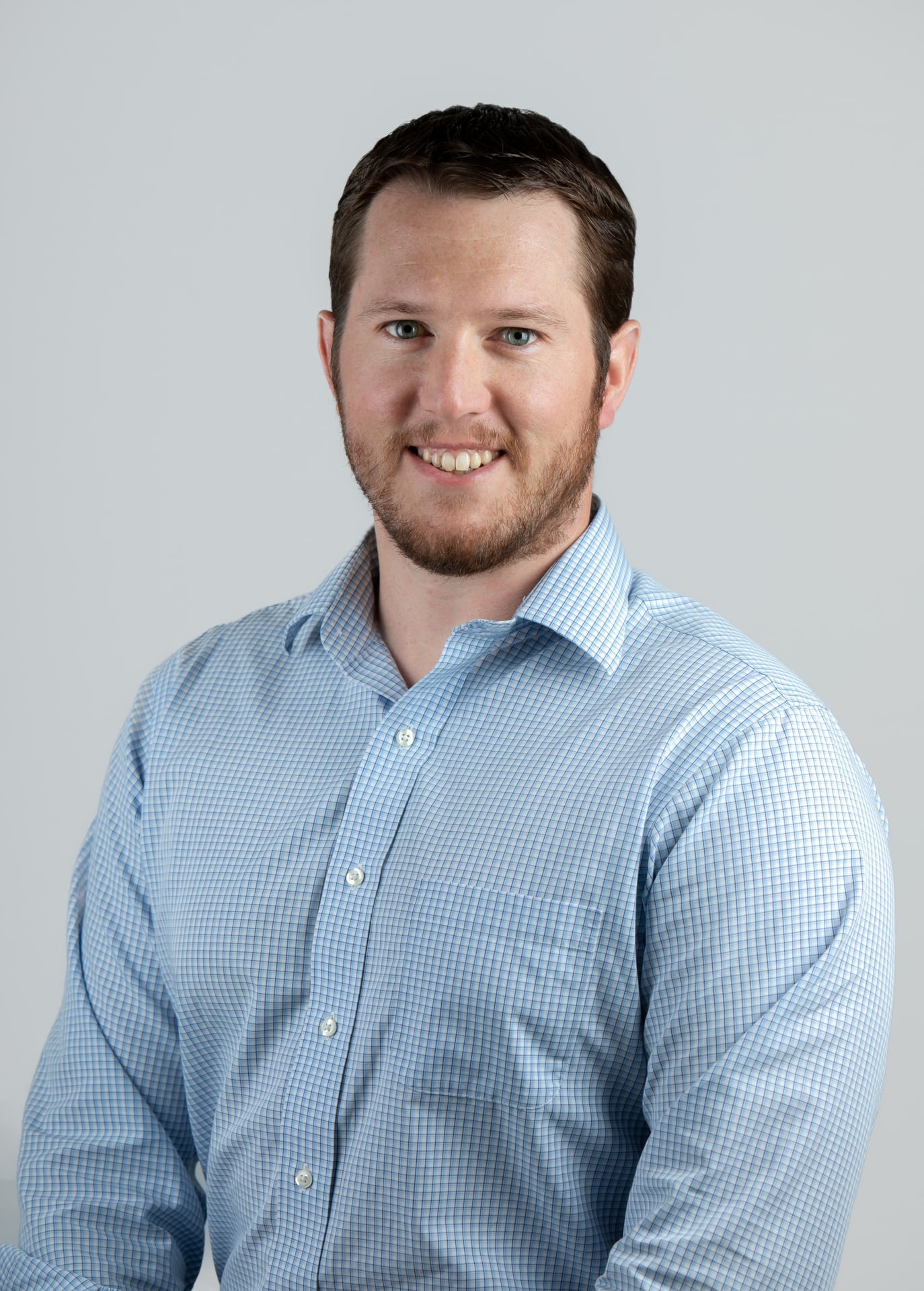 Portrait of Dave Littlefield, promoted to Senior Estimator at Jewett Construction.
