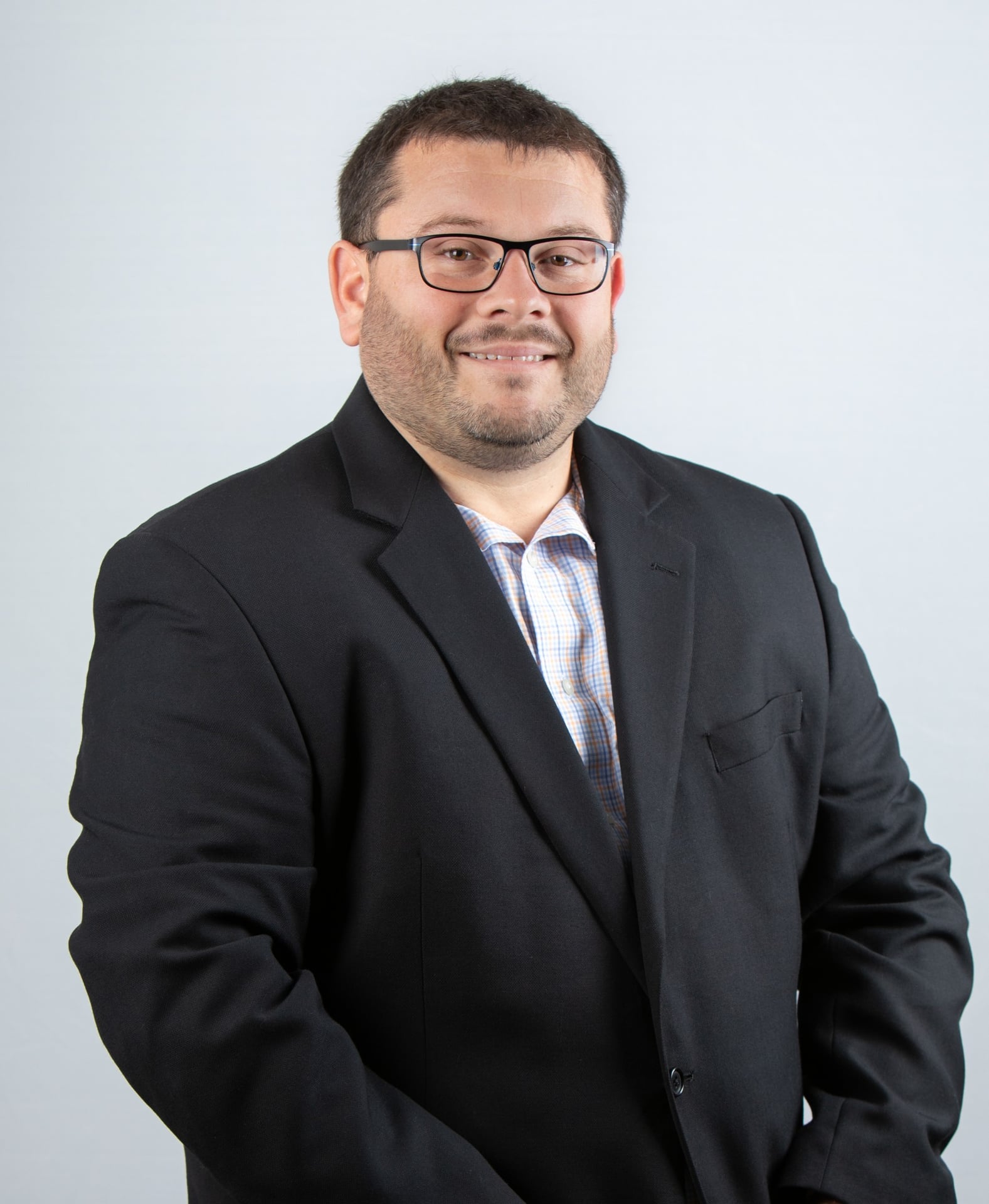 Professional headshot of Andrew Slazenik, promoted to Controller at Jewett Construction