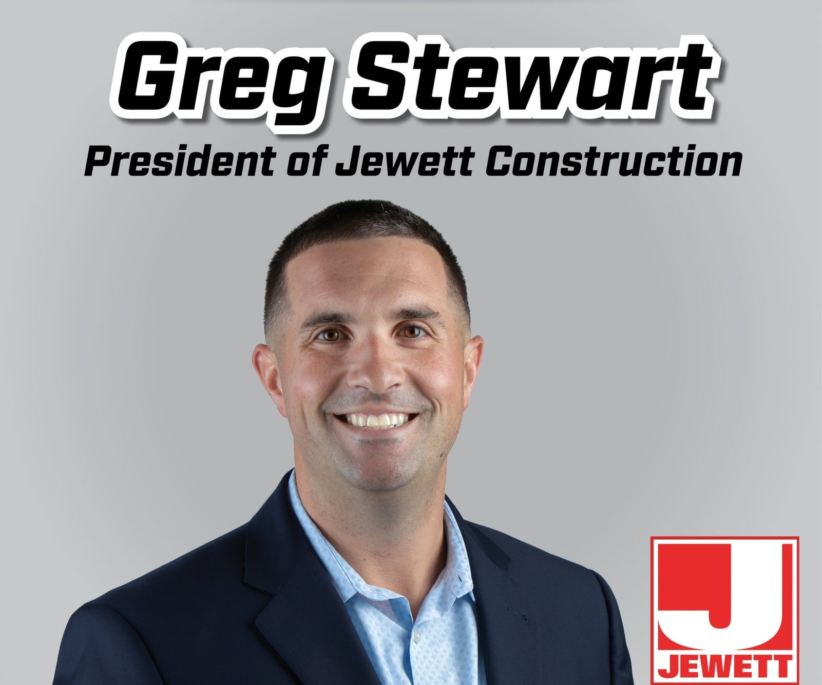 Professional headshot of Greg Stewart, newly appointed President of Jewett Construction, smiling in a dark suit and light blue shirt against a gray background. The Jewett Construction logo appears in the bottom right corner.
