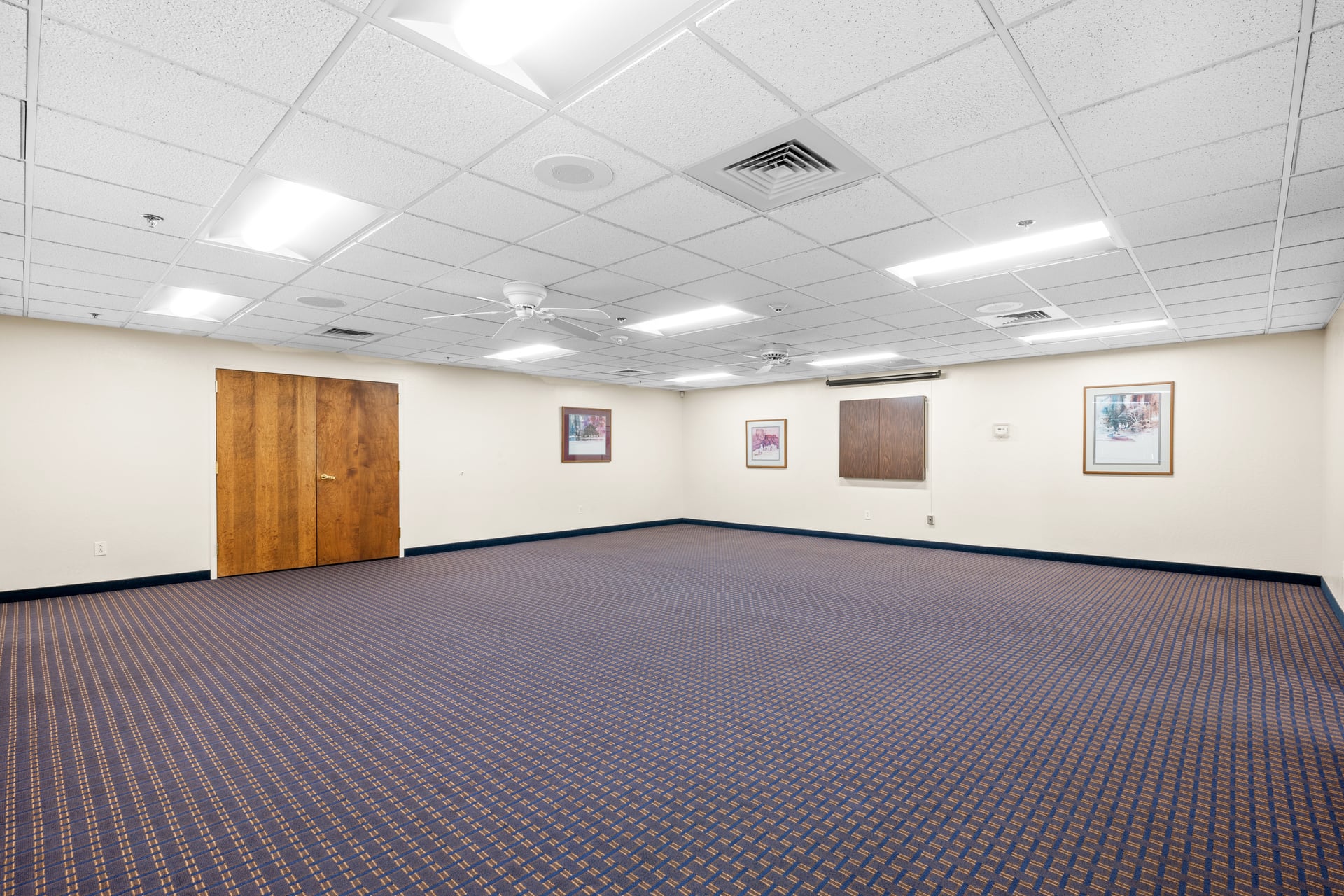 Smaller room with LED lighting and AV setup, perfect for meetings, workshops, or support groups in Sun City West.