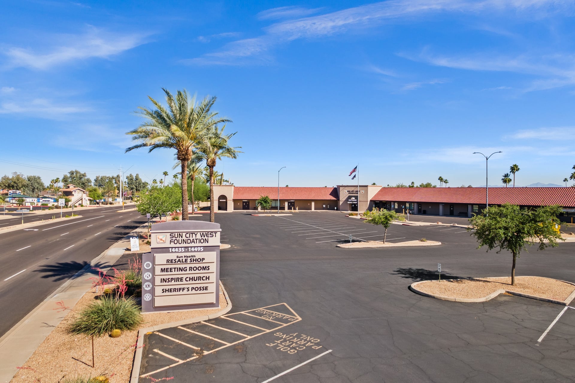 Resident meeting with an AARP Tax-Aide volunteer at a table with tax documents.