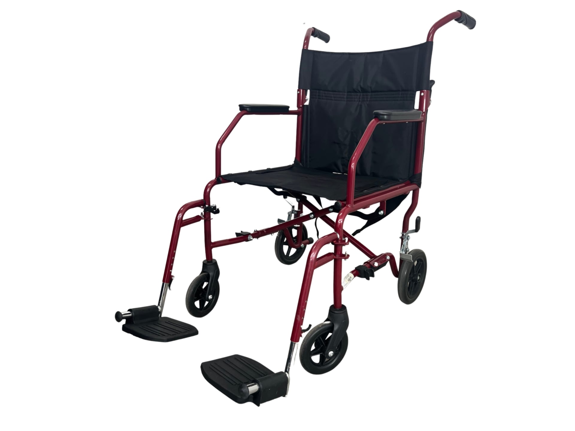 A lightweight companion wheelchair with a maroon-painted frame, black nylon seat and back, small four-inch wheels, rear push handles, and flip-up footrests for the user.