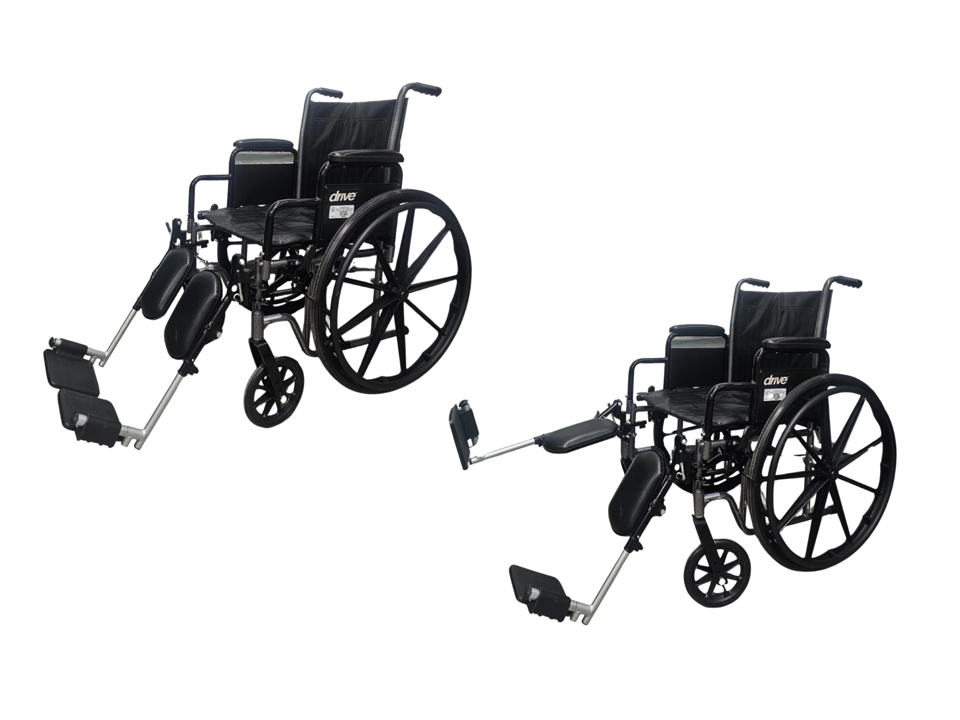A black vinyl wheelchair equipped with padded armrests, a pair of detachable forward-angled leg rests, large self-propelling rear wheels, and smaller swivel front casters.