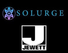 Jewett and Solurge logos on a black background, announcing the partnership to build a cannabis cultivation facility.