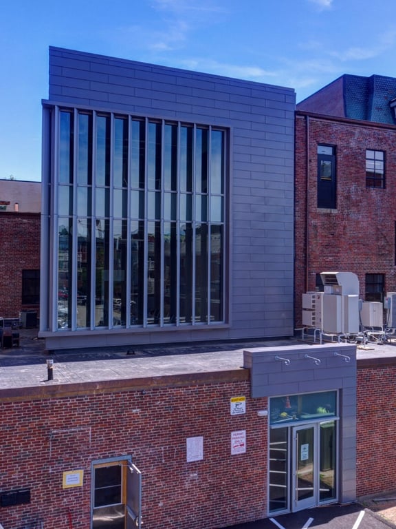 Modernized addition to a historic brick building completed by Jewett Construction, winner of the Paul & Niki Tsongas Preservation Award.