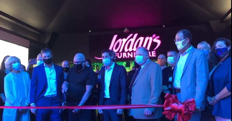 Jordan's Furniture CEO Eliot Tatelman cut the ribbon at the new Maine Mall location surrounded by his two sons Josh Tatelman and Michael Tatelman.